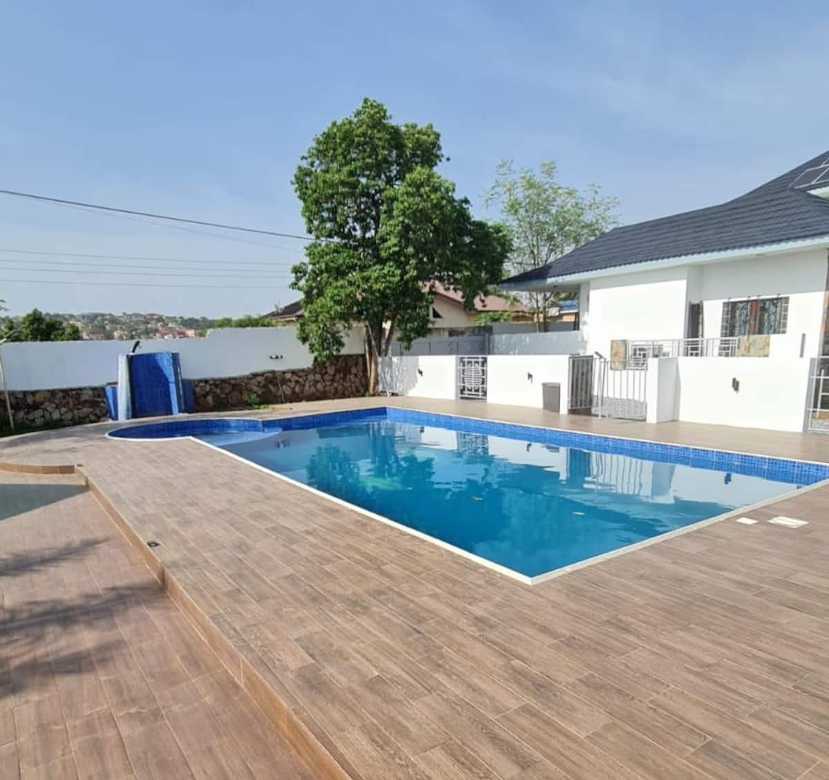 Outdoor swimming pool and poolside building at Summit Escape Gardens